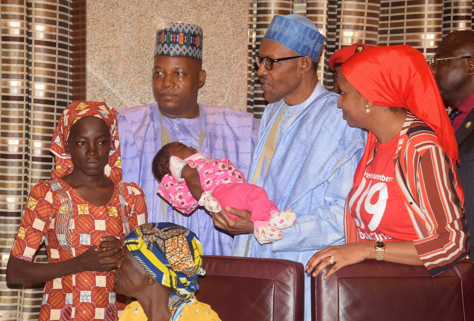 picture of Amina Ali, one of the found schoolgirls with President Muhammadu Buhari