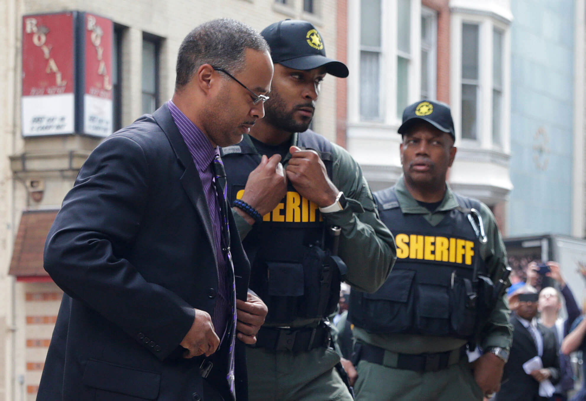 Officer Caeser Goodson walking into his trial in Baltimore