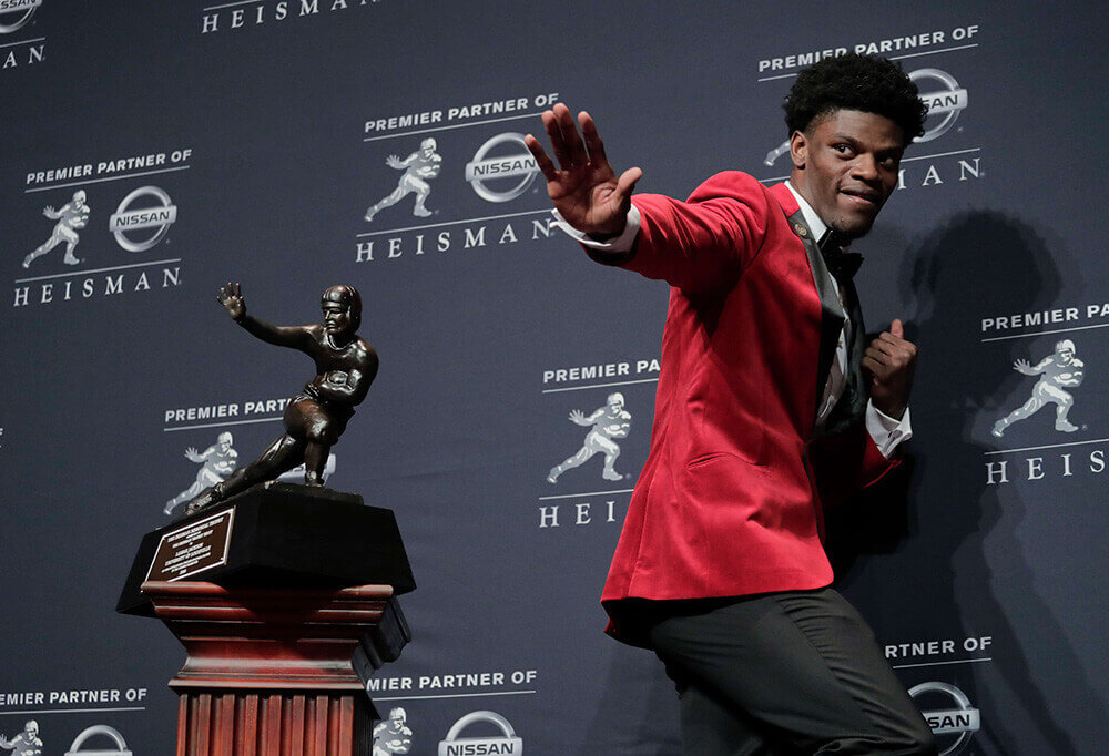 Image of Lamar Jackson with Heisman Trophy