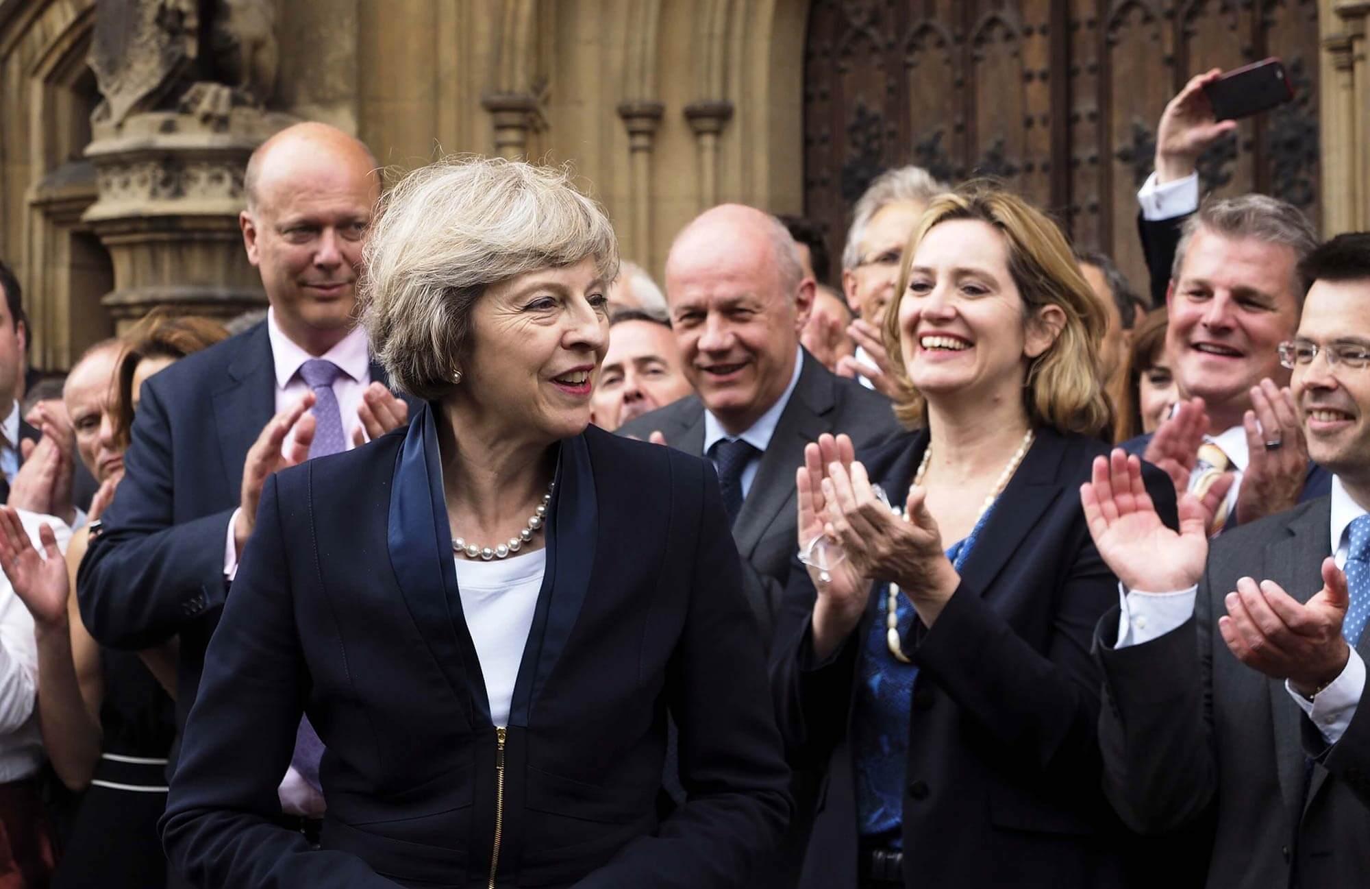 Image of Britain's new prime minister, Theresa May being applauded.