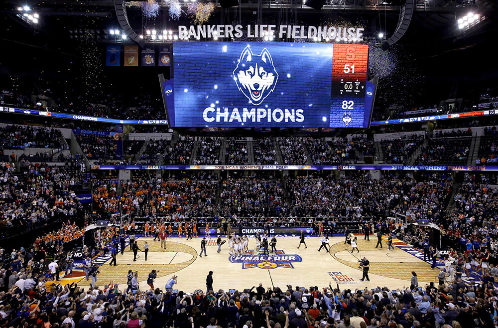 Women of the UConn huskies celebrate their NCAA win over Syracuse