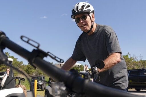 Biden falls off bike, unharmed