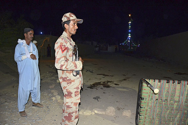 An officer guards the site of the bombings