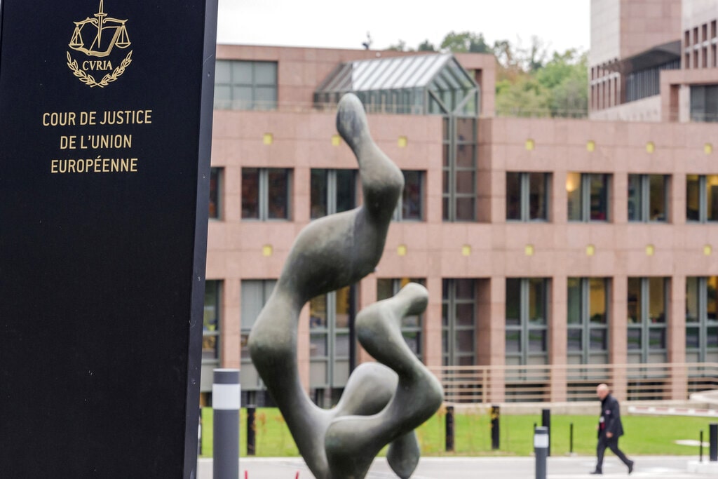 A man walks by the European Court of Justice in Luxembourg