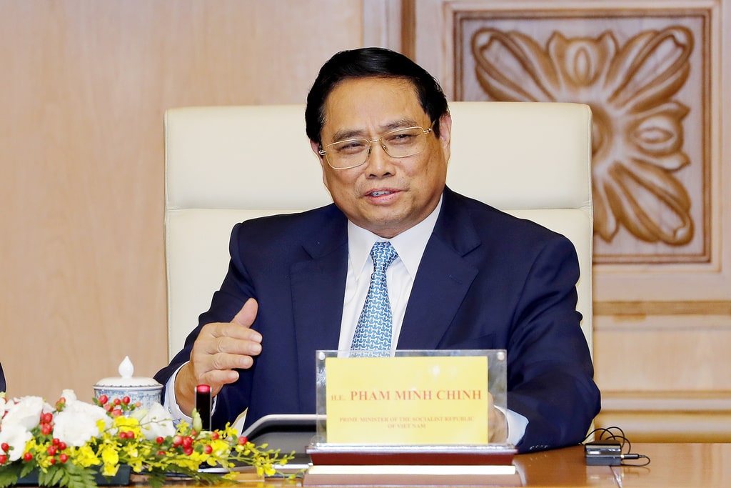 Vietnamese Prime Minister Pham Minh Chinh speaks to U.S. President Joe Biden during a business roundtable meeting at the Government Office in Hanoi, Vietnam, Monday, Sept. 11, 2023.