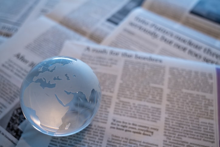 Glass globe on newspapers