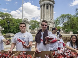 Teen volunteers gathered at a charity event outside - 10 Great Volunteer Ideas Kids and Teens Can Do Today