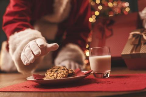 Santa Claus having a delicious snack